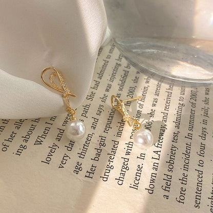 Nova | Golden Shell Pearl Knot Dangling Earrings – Sparkling & Elegant Jewelry for Women