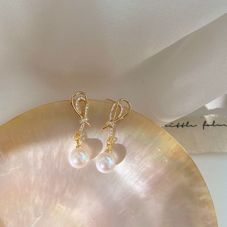 Nova | Golden Shell Pearl Knot Dangling Earrings – Sparkling & Elegant Jewelry for Women